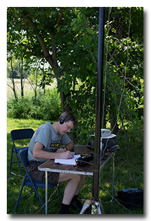 Eric operating under the mulberry tree-- click to enlarge