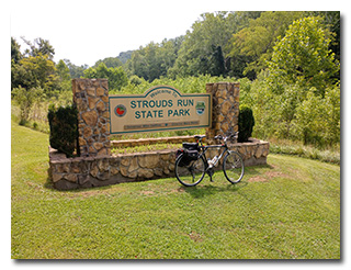 The Strouds Run State Park sign