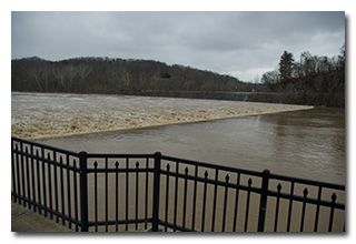 The swollen Muskingum River boiling over the dam