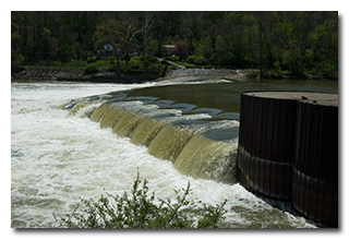 Water roars over the dam