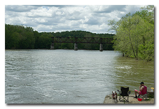 The abondoned railroad bridge over the Muskingum, plus a fisherman and his friend