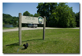 The Clouse Lake Wildlife Area sign, with Theo-dog
