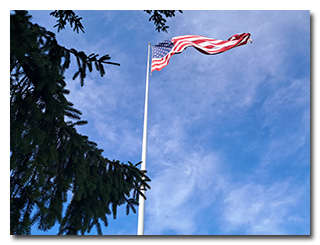 an American flag blows in the wind