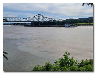 a barge passes on the Ohio River