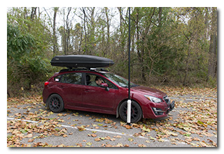 a man operating a radio in a car