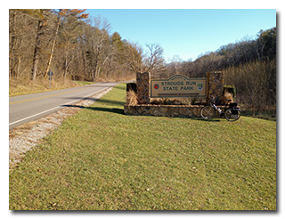 The Strouds Run State Park sign