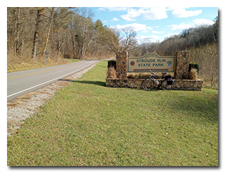 The Strouds Run State Park sign