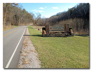 The Strouds Run State Park sign