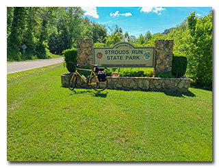 The Strouds Run State Park sign