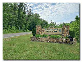 The Strouds Run State Park sign