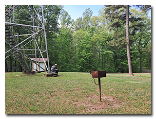 Tom operates his station at the base of the fire tower