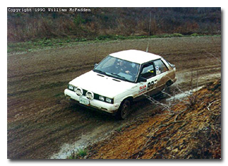 A muddy, sweeping turn at Sunriser 400 Forest Rally 1990