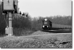 Ex-Conrail GP38-2 #8094 approaches the crossing at Penry Road on February 20, 2000.